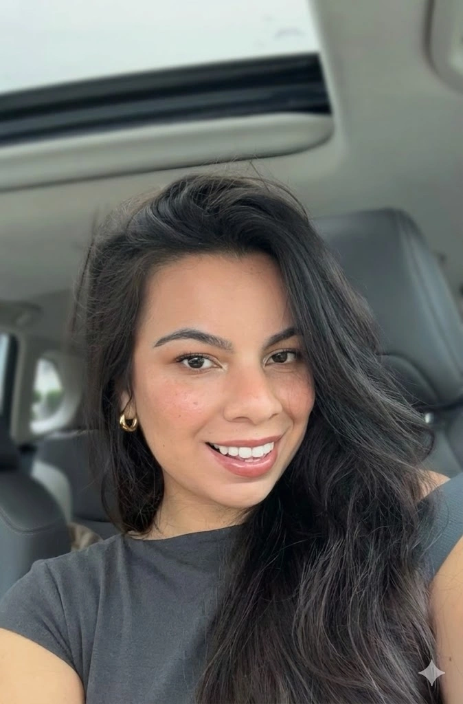 Portrait of Leticia, a certified postpartum and overnight doula in New York City, smiling in professional attire.