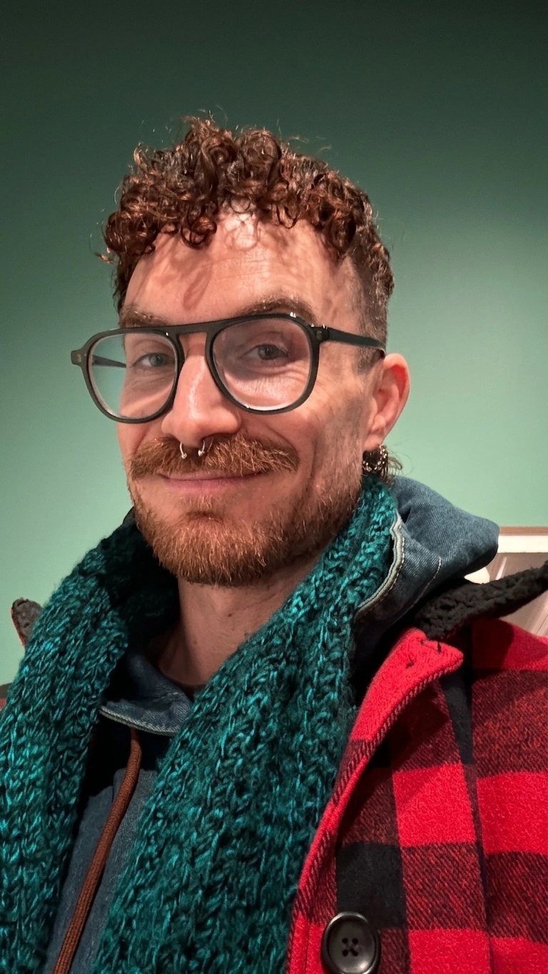 Portrait of Ari, a full-spectrum doula providing compassionate, inclusive birth and postpartum support for families in New York City.